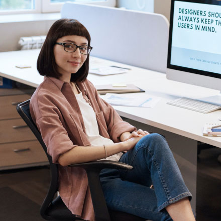 Woman Sitting on Chair at a Desk Woman Sitting on Chair at a Desk